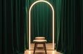 Empty fitting room features green velvet curtains and lighted mirror. Stool stands before a mirror in fitting room. Modern Royalty Free Stock Photo