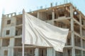 empty flag mockup waving in front of a halffinished building Royalty Free Stock Photo