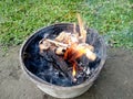 Empty flaming charcoal grill with open fire, ready for product placement. Royalty Free Stock Photo