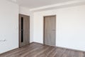 Empty flat after modern reconstruction with white walls and dark oak wooden floor Royalty Free Stock Photo