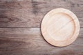 Empty flat wooden dish on wooden table top view