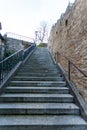 Empty flight of exterior stairs alongside a wall