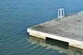 Empty floating jetty with ladder