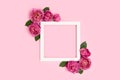 Empty flower frame made of rose on a pink pastel background Royalty Free Stock Photo