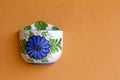 Empty flower pot on orange wall Royalty Free Stock Photo