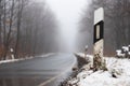 empty foggy winter forest street Royalty Free Stock Photo