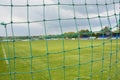 Empty football field with blue stands