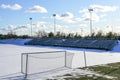 Empty football field in winter, covered with snow Royalty Free Stock Photo