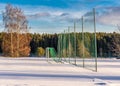 Empty Football (Soccer) Field in the Winter Partly Covered in Snow - Sunny Winter Day Royalty Free Stock Photo