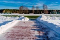 Empty Football (Soccer) Field in the Winter Partly Covered in Snow - Sunny Winter Day Royalty Free Stock Photo