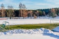 Empty Football (Soccer) Field in the Winter Partly Covered in Snow - Sunny Winter Day Royalty Free Stock Photo