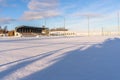 Empty Football (Soccer) Field in the Winter Partly Covered in Snow - Sunny Winter Day Royalty Free Stock Photo