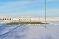 Empty Football (Soccer) Field in the Winter Partly Covered in Snow - Sunny Winter Day Royalty Free Stock Photo