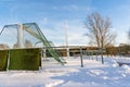 Empty Football (Soccer) Field in the Winter Partly Covered in Snow - Sunny Winter Day Royalty Free Stock Photo