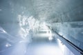 Empty footpath in tunnel passing through glacier in ice palace