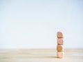 Empty four blank wooden cube block stack for your text, numbers or icon design isolated on wood table.