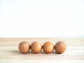 Empty four blank wooden spheres for your text or icon design isolated on white background.