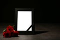 Empty frame with black ribbon and roses Royalty Free Stock Photo