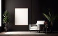 Empty frame on the black wall with copy space in the modern and chic living room with a white retro armchair, green plants Royalty Free Stock Photo