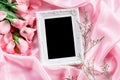 Empty frame with a bouquet sweet pink roses petal on sof Royalty Free Stock Photo