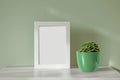 Empty frame and green flower pot Royalty Free Stock Photo