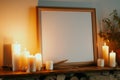 empty frame on a mantlepiece with candles beside Royalty Free Stock Photo