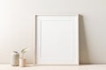 Empty frame mockup on empty neutral wall background. Royalty Free Stock Photo