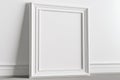 Empty frame mockup on empty neutral wall background. Royalty Free Stock Photo