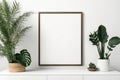 empty frame mockup in modern bright minimalist interior with plants on white wall background. template for painting, photo or Royalty Free Stock Photo