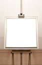Blank empty frame on painting easel, background