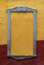 Empty frame Rustic Colonial mexican street, stone frame yellow and red wall.