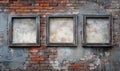 Empty frames on brick wall, three vintage frames, weathered brick background, urban art, textured surface Royalty Free Stock Photo