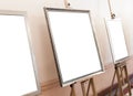 Blank empty frames on painting easel, background