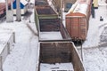Empty freight cars are at the train station. Old emergency wagons rust under the snow. View from above. Industrial Transport Royalty Free Stock Photo