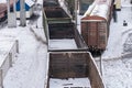 Empty freight cars are at the train station. Old emergency wagons rust under the snow. View from above. Industrial Transport Royalty Free Stock Photo