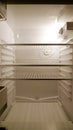 Empty fridge interior, frontal view