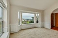 Empty front office room with large windows and arches