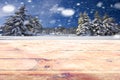 Empty frozen wooden table top in a snow forest landscape while snowing Royalty Free Stock Photo