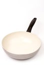 Empty frying ceramic pan on a white background