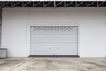 Empty garage with Shutter door or roller door and concrete floor Royalty Free Stock Photo