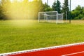 Empty gate on the football field with green grass Royalty Free Stock Photo