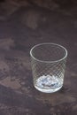 Empty glass beaker on a dark background