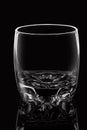 Empty glass on black background with highlights. Royalty Free Stock Photo