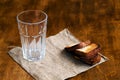 Empty glass with black rye bread and hard chucks