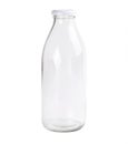 Empty glass bottle isolated on a white background. Clear bottle. Front view