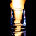 empty glass of brandy on fire, isolate Royalty Free Stock Photo