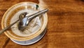 Empty Glass Cup with Spoon on Wooden Table Royalty Free Stock Photo