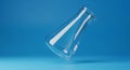 Empty Glass Erlenmeyer Flask Tilted on Blue Background analysis beaker Royalty Free Stock Photo