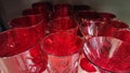 Empty glass glasses in even rows on the shelf. Glassware as background, texture, pattern