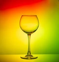 Empty glass goblet close-up on a color gradient background Royalty Free Stock Photo